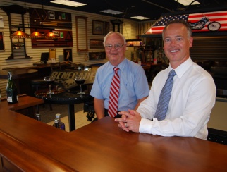 Bob Jones III (right) with father Robert Jones, Sr. (left). Take a closer look at an American Sale store.
